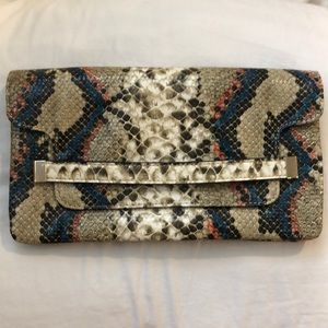 Team and orange crocodile clutch